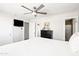 Bright bedroom with a ceiling fan, modern decor, and wood-look floors at 8201 E Piccadilly Rd, Scottsdale, AZ 85251
