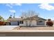 Charming single-story home with a well-manicured front yard and inviting curb appeal at 8201 E Piccadilly Rd, Scottsdale, AZ 85251