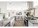Bright kitchen with modern appliances and granite counters overlooks spacious dining area at 8201 E Piccadilly Rd, Scottsdale, AZ 85251