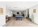Spacious living room features a billiards table, fireplace, and tile floors at 8201 E Piccadilly Rd, Scottsdale, AZ 85251