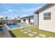Attractive backyard with a pool, turf, and patio areas ideal for outdoor living and entertainment at 8201 E Piccadilly Rd, Scottsdale, AZ 85251