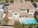 Stunning aerial view of the home with a backyard oasis, including a pool and spa at 937 W Glacier Dr, Chandler, AZ 85248
