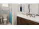 Stylish bathroom featuring modern fixtures, wood vanity, white countertop, and a blue shower curtain at 937 W Glacier Dr, Chandler, AZ 85248