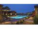 Beautiful community pool at twilight, surrounded by lush landscaping, offering residents a relaxing oasis at 937 W Glacier Dr, Chandler, AZ 85248