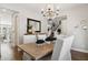 Elegant dining room with wood floors, stylish chandelier, and decorative accents at 937 W Glacier Dr, Chandler, AZ 85248