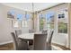 Elegant dining room with a round table, chandelier lighting, and plenty of natural light at 937 W Glacier Dr, Chandler, AZ 85248