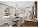 Formal dining room featuring a large window, stylish chandelier, and sophisticated decor at 937 W Glacier Dr, Chandler, AZ 85248