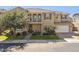 Charming two-story home featuring a balcony, well-manicured landscaping, and a welcoming front porch at 937 W Glacier Dr, Chandler, AZ 85248