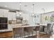 Bright kitchen with a large island, modern appliances, and an adjacent dining area at 937 W Glacier Dr, Chandler, AZ 85248
