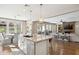 Open kitchen with island, pendant lighting, and seamless flow to the dining and living areas at 937 W Glacier Dr, Chandler, AZ 85248
