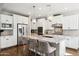 Modern kitchen with granite countertops, stainless steel appliances, and pendant lighting at 937 W Glacier Dr, Chandler, AZ 85248