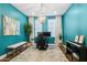 Stylish home office featuring vibrant blue walls, a contemporary chandelier, and a functional layout at 937 W Glacier Dr, Chandler, AZ 85248