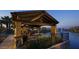 Community pavilion with lake views, fireplace, and seating provides a relaxing outdoor gathering space at 937 W Glacier Dr, Chandler, AZ 85248