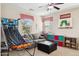 Well-lit playroom features fun activities and comfortable lounge area at 937 W Glacier Dr, Chandler, AZ 85248