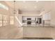 Well-lit kitchen featuring white cabinets, stainless steel appliances, granite countertops, and an open layout at 9715 E Osage Ave, Mesa, AZ 85212