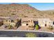 A high angle view of a home with a two-car garage and drought tolerant landscaping in front at 10038 W Redbird Rd, Peoria, AZ 85383