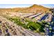 A high angle view of a well-manicured community park surrounded by desert landscaping and homes at 10038 W Redbird Rd, Peoria, AZ 85383