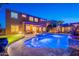 Large backyard features a swimming pool, spa, putting green, outdoor kitchen and patio area at 10038 W Redbird Rd, Peoria, AZ 85383
