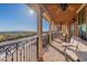 Covered balcony with wrought iron railing and views of mountain landscape at 10038 W Redbird Rd, Peoria, AZ 85383