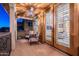 Covered balcony with furniture and entry to bedroom with plantation shutters at 10038 W Redbird Rd, Peoria, AZ 85383
