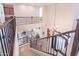 Elegant foyer features a grand staircase, chandelier, and views into the living room at 10038 W Redbird Rd, Peoria, AZ 85383