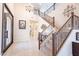 Grand foyer with high ceilings, staircase, and decorative front door at 10038 W Redbird Rd, Peoria, AZ 85383