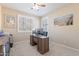 This office features neutral walls, carpet, a ceiling fan, and shutters on the windows at 10038 W Redbird Rd, Peoria, AZ 85383