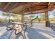 Covered picnic area with tables, stone columns, and views of the playground at 10038 W Redbird Rd, Peoria, AZ 85383