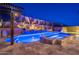 Backyard pool with desert landscape lighting and spa at 10038 W Redbird Rd, Peoria, AZ 85383