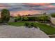 Serene backyard showcasing lush lawn, mature trees, and a brick patio area at 11544 W Ashby Dr, Peoria, AZ 85383