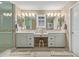 A well-lit bathroom features a glass enclosed shower and double sinks at 11544 W Ashby Dr, Peoria, AZ 85383