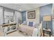 A spare bedroom with a day bed, neutral colored bedding and a work space at 11544 W Ashby Dr, Peoria, AZ 85383