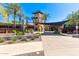 Community center entrance surrounded by lush landscaping and shade structures at 11544 W Ashby Dr, Peoria, AZ 85383