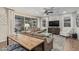 Open concept living room with large windows, ceiling fan, neutral paint and modern furnishings at 11544 W Ashby Dr, Peoria, AZ 85383