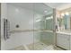 A well-lit shower area features glass door, mosaic tiling and tiled flooring at 11544 W Ashby Dr, Peoria, AZ 85383