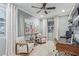 Comfortable sitting area with stylish decor, artwork, natural light, and a writing desk at 11544 W Ashby Dr, Peoria, AZ 85383