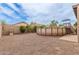 Backyard featuring an above-ground pool, stone landscaping, and privacy fence at 13001 W Bloomfield Rd, El Mirage, AZ 85335