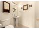 Powder room featuring stylish pedestal sink and decorative mirrors at 13001 W Bloomfield Rd, El Mirage, AZ 85335