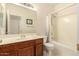Bright bathroom with a vanity, and a shower-tub combo with a curtain at 13001 W Bloomfield Rd, El Mirage, AZ 85335