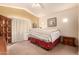 Comfortable bedroom featuring a cozy bed and window with natural light at 13001 W Bloomfield Rd, El Mirage, AZ 85335