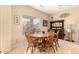 Cozy dining area with a round wooden table and decorative buffet at 13001 W Bloomfield Rd, El Mirage, AZ 85335
