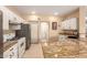 Bright kitchen featuring white cabinets, granite countertops, and stainless appliances at 13001 W Bloomfield Rd, El Mirage, AZ 85335