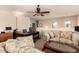 Cozy living room area with comfortable seating and a ceiling fan at 13001 W Bloomfield Rd, El Mirage, AZ 85335