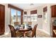 Bright breakfast nook with tiled floors surrounded by large windows and cabinet storage at 13064 W Big Oak St, Peoria, AZ 85383