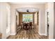 A bright dining room showcases a wood table, built-in cabinets, and an arched entryway at 13064 W Big Oak St, Peoria, AZ 85383
