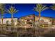 Beautifully designed exterior entrance with palm trees and modern architecture, creating a welcoming and sophisticated arrival at 13064 W Big Oak St, Peoria, AZ 85383