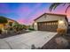 This well-maintained home features a two-car garage, desert landscaping, and a concrete driveway at 13064 W Big Oak St, Peoria, AZ 85383