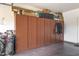 Garage with built-in storage cabinets along a wall to keep everything neat and tidy at 13064 W Big Oak St, Peoria, AZ 85383