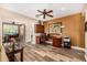 Home office with built-in cabinets, natural light, and wood-look flooring at 13064 W Big Oak St, Peoria, AZ 85383