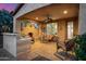 Covered patio featuring a built-in BBQ and seating area with a fireplace, ideal for outdoor living at 13064 W Big Oak St, Peoria, AZ 85383